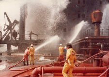 Fire teams in action on Al Ahood's main deck, following two Exocet hits on the tanker in May 1984. 